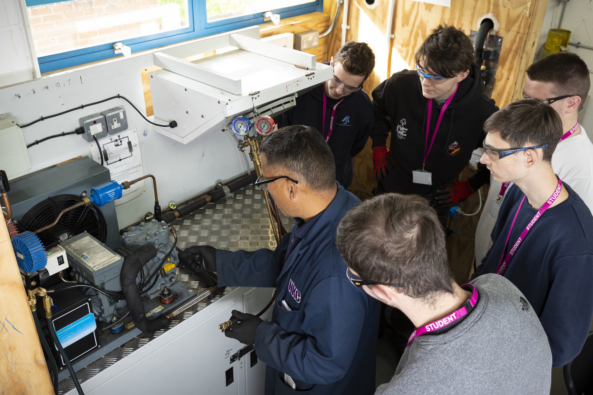 Refrigeration students and teacher